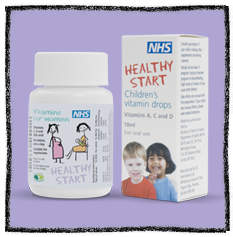 Healthy Start Vitamins - Photograph against purple background of a white container with healthy start vitamins and vitamin drops on the label.